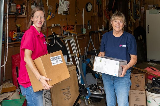 Two Caring Transitions team members at work.